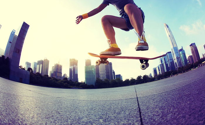 Skateboarder taken with fisheye lens distortion